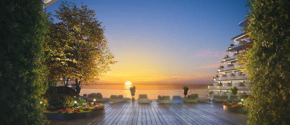 The terraces face the water; the decks sit between the blocks and the private beach.