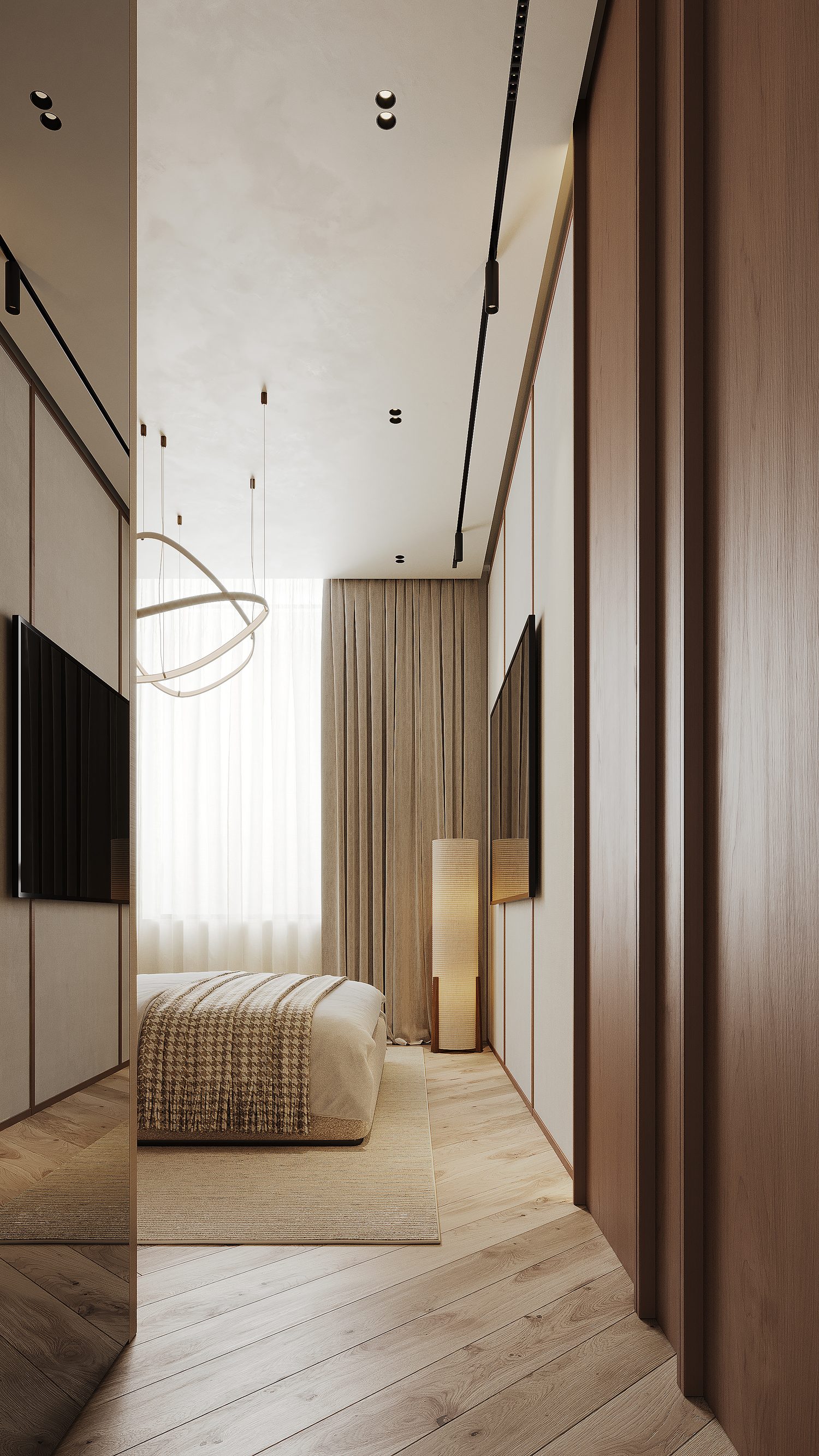 The dressing run between the bedroom and the bathroom — mirrored on one side, joinery on the other.
