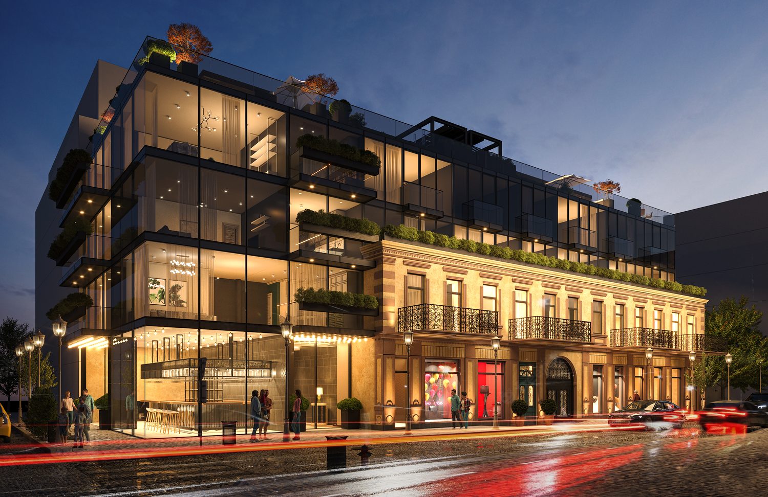 The corner at dusk and again after dark — the glass volume lit from inside, the restaurant and bar at street level.