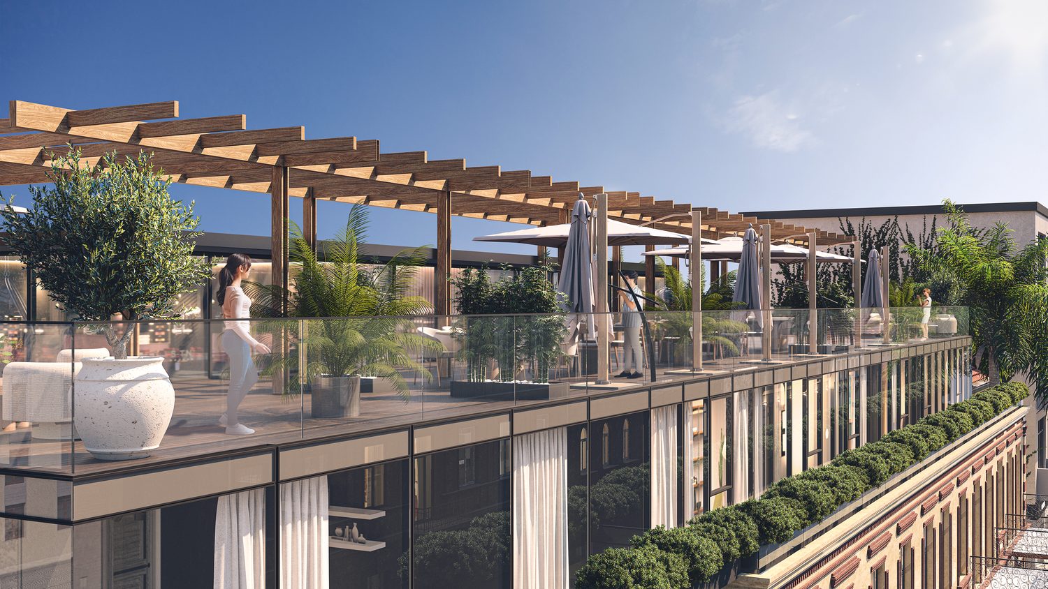 The roof terrace under its pergola, and the building from the street in daylight.